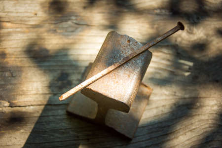 Original old vintage rusty handmade victorian iron nail used in construction.の写真素材