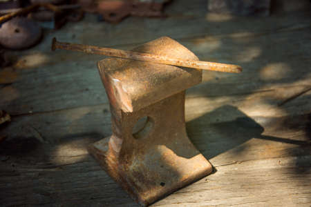 Original old vintage rusty handmade victorian iron nail used in construction.