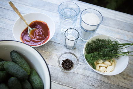 The process of preserving pickled cucumbers for the winter. Ingredients for preservation: dill,...