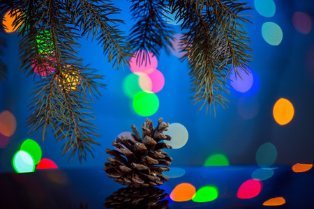 Christmas sparkling and fabulous background with pine cones with copy space. Christmas background for postcards. Christmas decoration concept.の写真素材