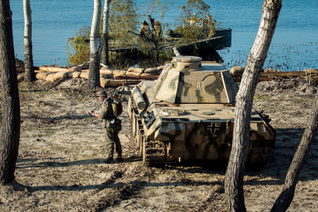 Dnepr, Ukraine - 10.29.2013: Military enactment show of WW2 period with tanks, aircraft, vehicles and people in period costume and uniform. Restoration of the Battle for the liberation of Dneprのeditorial素材