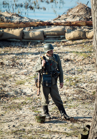 Dnepr, Ukraine - 10.29.2013: Military enactment show of WW2 period with tanks, aircraft, vehicles and people in period costume and uniform. Restoration of the Battle for the liberation of Dneprのeditorial素材