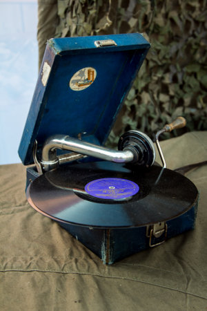 Dnepr, Ukraine - 10.29.2013: Military enactment show of WW2 period with tanks, aircraft, vehicles and people in period costume and uniform. Gramophone from the Second World War.のeditorial素材