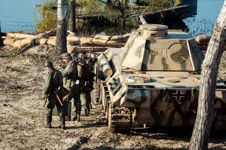 Dnepr, Ukraine - 10.29.2013: Military enactment show of WW2 period with tanks, aircraft, vehicles and people in period costume and uniform. Restoration of the Battle for the liberation of Dneprのeditorial素材