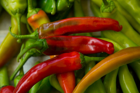 Hot chili pepper background. Red and green peppercorns as a background. Healthy food concept.の写真素材