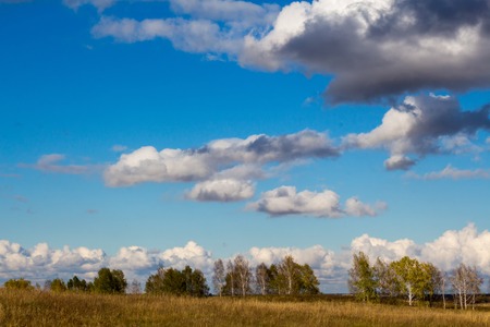 autumn clouds over the fields beautiful landscapeの写真素材