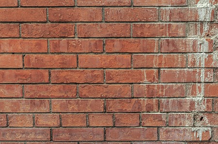 texture wall brick red color of an uneven surface