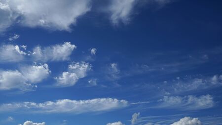 Blue sky with clouds and sun.の写真素材