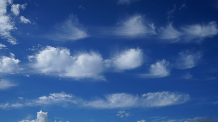 Blue sky with clouds and sun.の写真素材