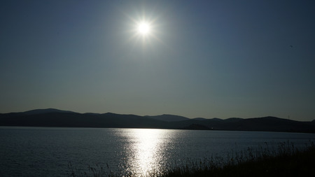 sunset on the lake in the summer of Augustの写真素材