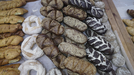 fresh bread and wheat on the woodenの写真素材