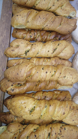 fresh bread and wheat on the woodenの写真素材