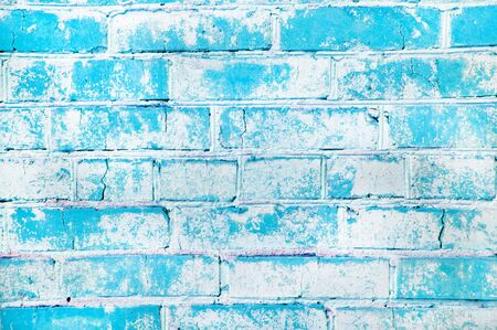 Texture of an old brick wall. Grunge blue stone wall background. Old masonry, shabby facade. Vintage...