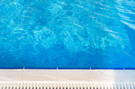 Outdoor pool with blue mosaic bottom. Pool side.の写真素材