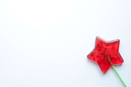 Lollipop star on a white background. Christmas concept. Copy space.Flat lay
