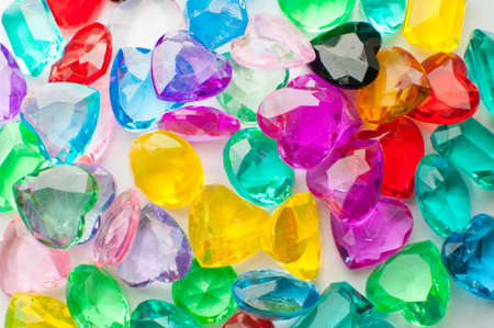 Multicolored hearts crystals on white background.の写真素材