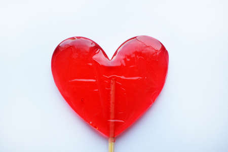 Red lollipops. Red hearts. Candy. Love and sweet concept. Valentine day. White background.