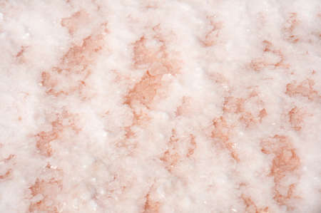 Close-up of crystals of pink salt on a salt lake. Salt background textureの写真素材