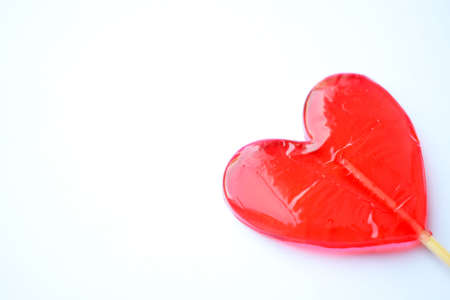 Red lollipops. Red hearts. Candy. Love and sweet concept. Valentine day. White background.の写真素材
