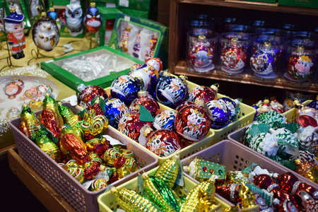 Krasnodar, Russia - December 15, 2020: Multicolored Christmas tree toys at the Christmas fair. Glass painted Christmas ballsのeditorial素材