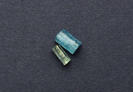 Natural crystals of aquamarine on a gray dark background. Baikal aquamarines.の写真素材
