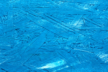 Blue painted background of wood panels, oriented strand board - OSB wood. Board for the attic.の写真素材