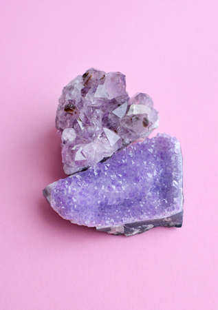 Beautiful big crystals of amethyst on a pink background.Amethyst purple druzes of high quality.の写真素材