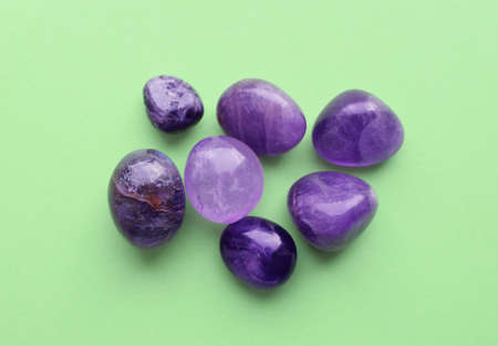 Gems of different colors. Amethysts on a green background.の写真素材