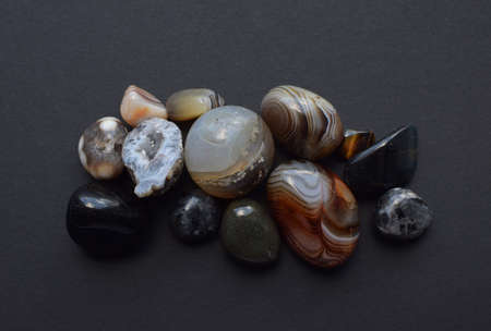 Multicolored gemstones, tumbled minerals. Agates of various sizes. Bostwan agate, druse citrine and...