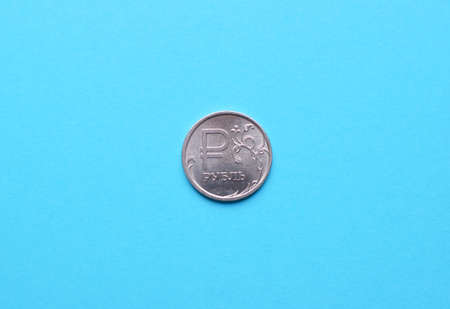 Russian national coin of denomination of one ruble close-up on a blue background.の写真素材