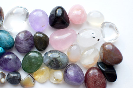 Gemstones of different colors. Amethyst, rose quartz, agate, apatite, aventurine, olivine, turquoise, aquamarine, rock crystal on a white background..の写真素材
