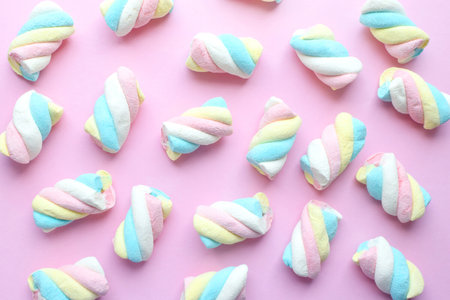 Marshmallow. Close-up of colorful gummies on a pink background. Candiesの写真素材
