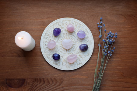 Gemstones for zodiac signs, amethysts and rose quartz on the zodiac chart. Predictions, witchcraft, spiritual esoteric practice.の写真素材