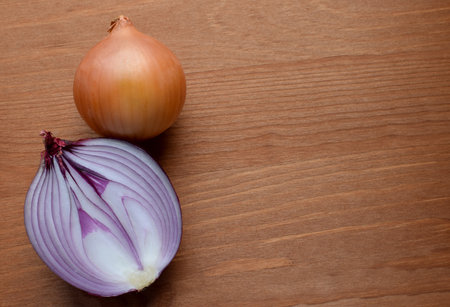 Red onions on a rustic wooden background. Copy space.の写真素材