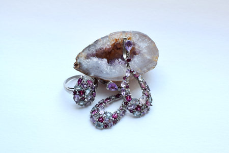 Beautiful silver earrings with natural semi-precious stones: garnets - rhodolites, amethysts and topazes.の写真素材