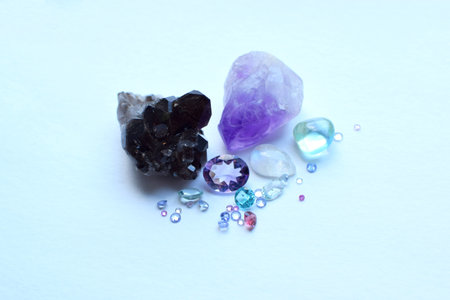 Beautiful faceted natural stones of sapphires, topazes and amethysts on a white background.の写真素材