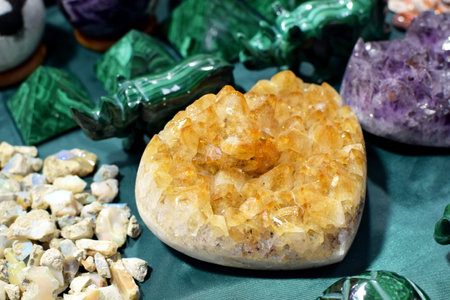 Beautiful intergrowth of citrine crystals at the stone exhibition. Natural stones amethyst, rock crystal, malachite at the stone fairの写真素材