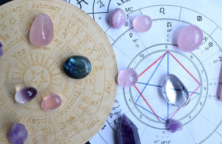Beautiful amethyst crystals and dry herbs with symbols of the zodiac signs. Predictions, witchcraft, spiritual esoteric practice.の写真素材
