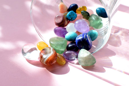 Amethyst, lapis lazuli, agate and fluorite close-up in a glass vase. Healing crystals.の写真素材