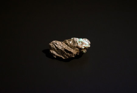 A precious emerald nugget set in phlogopite mica. Beryl, emerald, natural crystal.