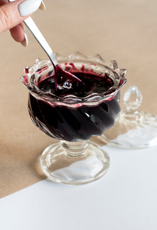 Blackberry jam in the glass bowl
