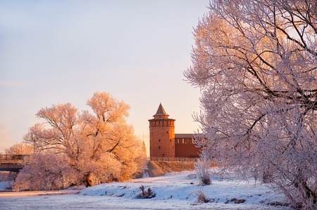 Kolomna Kremlin in winter at sunrise on the background of snowy treesの写真素材