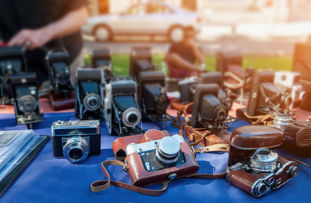 Old cameras are sold at a street market on a Sunny day. The horizontal frame.の写真素材