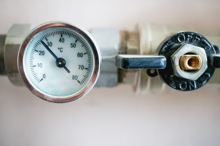 Pressure gauge for regulating the temperature of the water in the heating system. The horizontal...