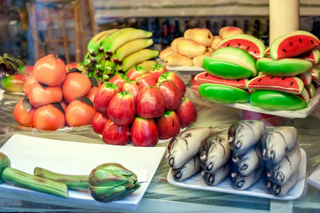 Pastry with marzipan in the form of fruit and fish. Typical Sicilian. The horizontal frame.の写真素材