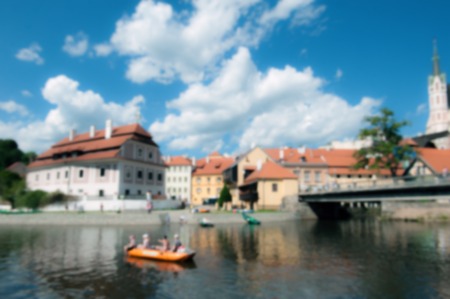 Blurred background a beautiful landscape of a European city with the river boat and bridge in Sunny day.の写真素材