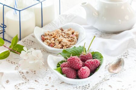 Ripe raspberry from the city garden for Breakfast with tea and homemade jam.の写真素材