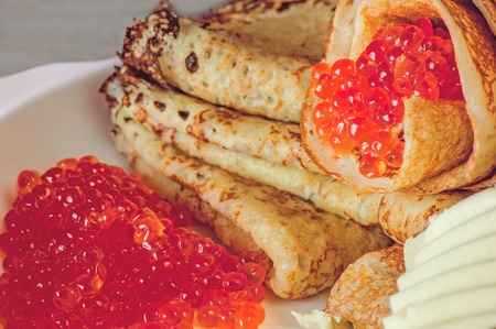 Delicious pancakes with caviar, salmon close upの写真素材