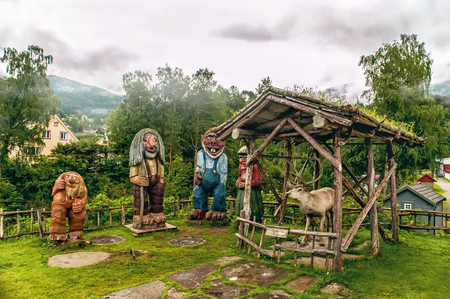Kinsarvik. Norway. A Norwegian carved wood Troll sculpture on a background of mountains. August 1 2013. Editorialのeditorial素材