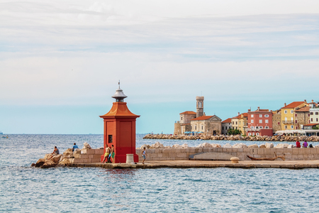 Piran, Slovenia. August 26, 2012. Beautiful view of the coast with a lighthouse and a Bay at dawn.のeditorial素材
